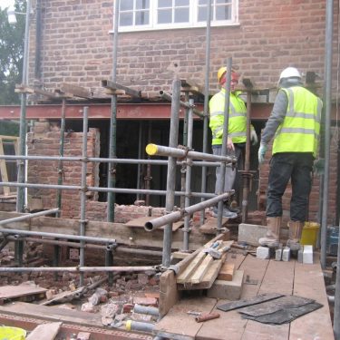 Beam secured in position